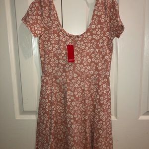 Peach dress with white flowers on it! Never worn